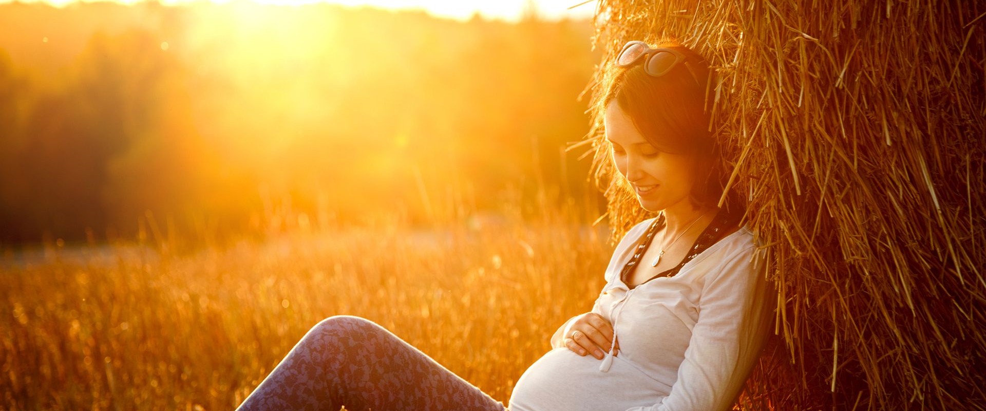 Pregnant woman holding stomach