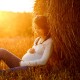 Pregnant woman holding stomach